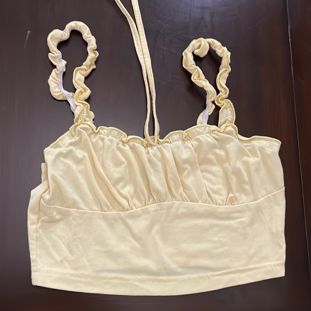 i’m selling this light yellow crop tang top.